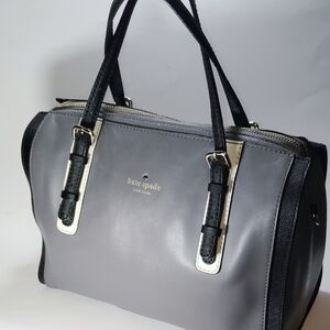 The Kate Spade Bedford Square leather handbag, sho strap is missing is a stylish